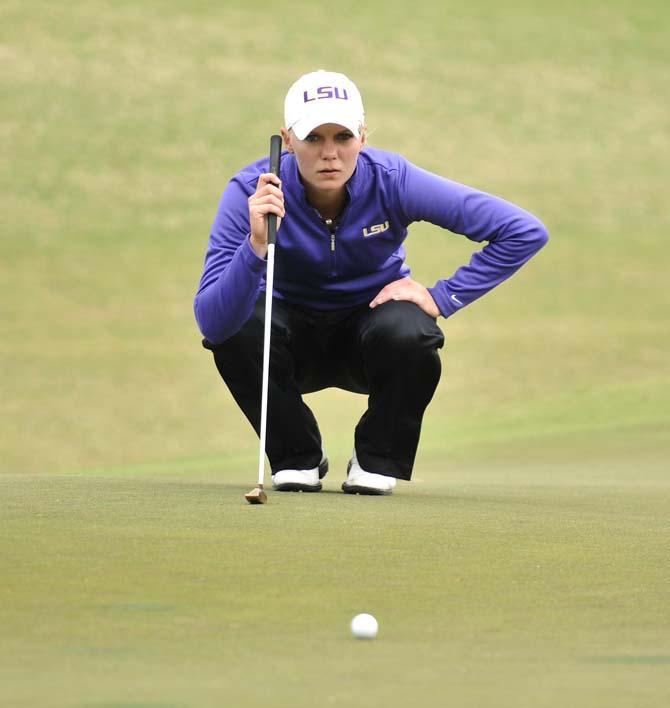 LSU sophomore Madelene Sagstrom focuses the ball Sunday, March 24, 2013 on the last hole of her game during the LSU Tiger Golf Classic at the University Club golf course.