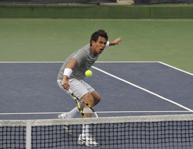 LSU senior Stefan Szacinski hits the ball Sunday, March 17, 2013, during a doubles match against Michigan in W.T. "Dub" Robinson Stadium.
 