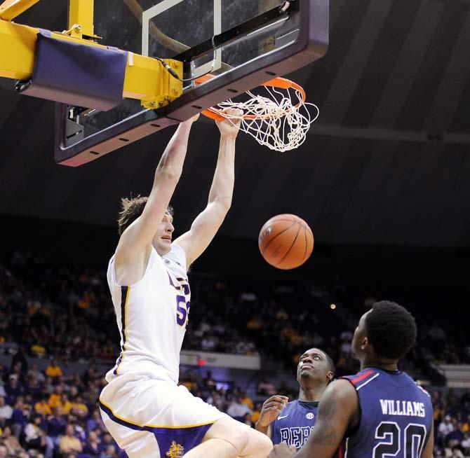 LSU senior center Andrew Del Piero (55) dunks over Ole Miss defenders March 9, 2013 during the Tiger's 67-81 loss to Ole Miss in the PMAC.
 