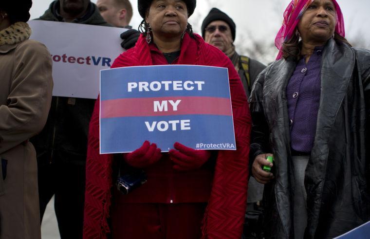 People wait in line outside the Supreme Court in Washington, Wednesday, Feb. 27, 2013, to listen to oral arguments in the Shelby County, Ala., v. Holder voting rights case. The justices are hearing arguments in a challenge to the part of the Voting Rights Act that forces places with a history of discrimination, mainly in the Deep South, to get approval before they make any change in the way elections are held. (AP Photo/Evan Vucci)
 