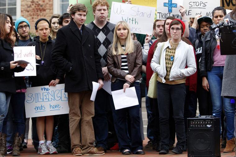 UNC-Chapel Hill sophomore Landen Gambill, center, stands with supporters during a rally Friday March 1, 2013, on the steps of the South Building on campus. Gambill was informed last week by the student-run judicial system that she has been charged with an honor code violation for speaking out about alleged abuse and sexual violence by an ex-boyfriend, who also is a student. (AP Photo/The News &amp; Observer, Travis Long)
 