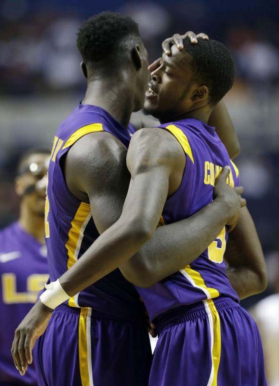 LSU forwards Johnny O'Bryant III, left, and Shavon Coleman (5) embrace after defeating Georgia 68-63 in an NCAA college basketball game at the Southeastern Conference tournament, Thursday, March 14, 2013, in Nashville, Tenn. (AP Photo/Dave Martin)
 