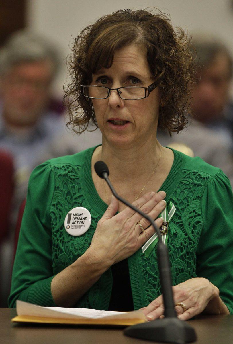 Jane Dougherty, of Colorado, the sister of Mary Sherlach, the school psychologist killed in the Sandy Hook Elementary massacre, testifies in favor of proposed gun control legislation in the Colorado Legislature, at the State Capitol, in Denver, Monday March 4, 2013. State Senate committees began work Monday on a package of gun-control measures that already have cleared the House which include limits on ammunition magazine sizes and expanded background checks to include private sales and online purchases. (AP Photo/Brennan Linsley)