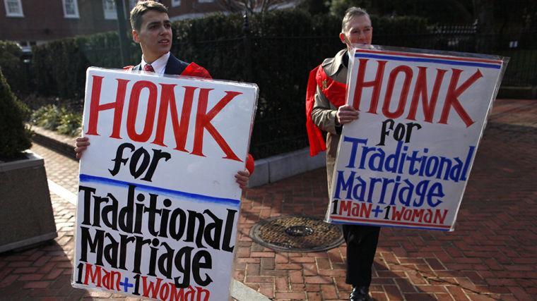 Zachariah Long (left) and Edward Ritchie protest against a gay-marriage bill in Annapolis, Md., on Feb. 17. The bill passed, but the issue is being put directly to Maryland voters on Nov. 6.
 