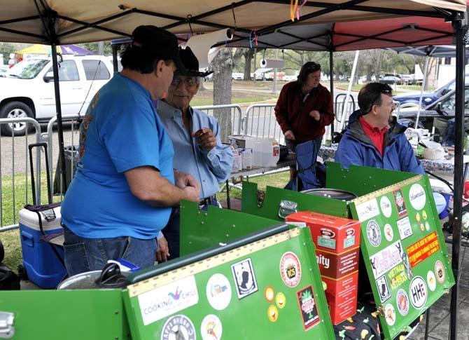 Larry Weltikol, Palm Coast, FL native, speaks to a fellow chili cookoff participant Saturday, March 9, 2013.
 