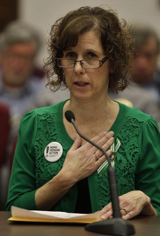 Jane Dougherty, of Colorado, the sister of Mary Sherlach, the school psychologist killed in the Sandy Hook Elementary massacre, testifies in favor of proposed gun control legislation in the Colorado Legislature, at the State Capitol, in Denver, Monday March 4, 2013. State Senate committees began work Monday on a package of gun-control measures that already have cleared the House which include limits on ammunition magazine sizes and expanded background checks to include private sales and online purchases. (AP Photo/Brennan Linsley)
 