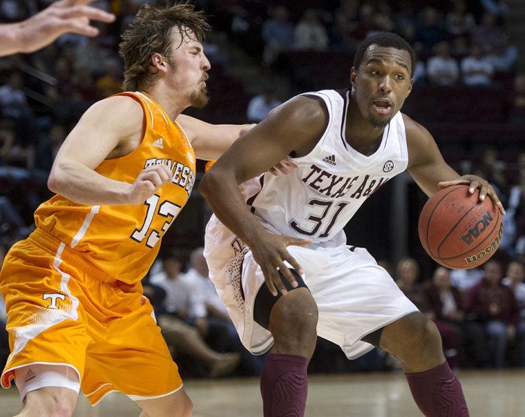 Texas A&amp;M's Elston Turner (31) moves the ball up the court against Tennessee's Skylar McBee during the first half of an NCAA college basketball game in College Station, Texas, Saturday, Feb. 23, 2013. (AP Photo/Bryan College Station Eagle, Stuart Villanueva)
 