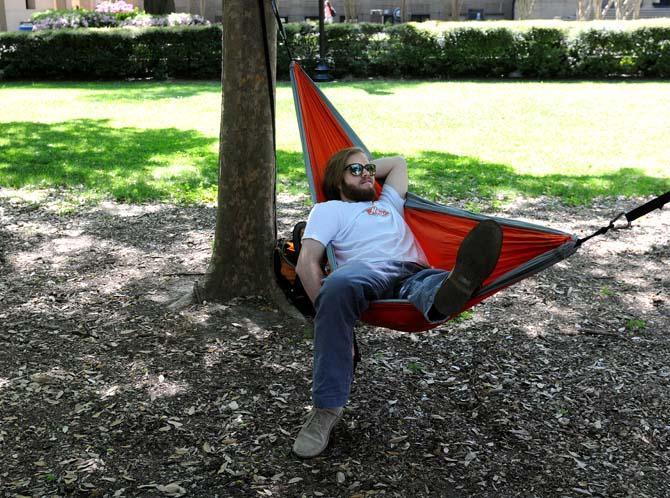 History junior Connor Roberts relaxes in the hammock he set up in the quad Tuesday, March 19, 2013.