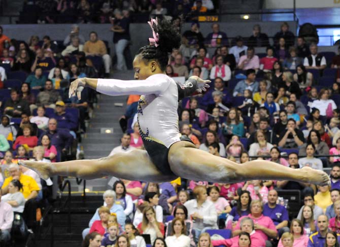 LSU sophomore all-around Lloimincia Hall leaps off the balance beam March 8, 2013, during the Tigers' 197.500-197.725 loss against Alabama at the PMAC.
 