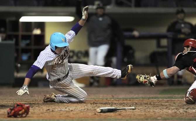 LSU freshman shortstop Alex Bregman (30) unsucessfully dives into home Wednesday, March 13, 2013 during the 9-3 victory against Nicholls State at Alex Box Stadium.
 