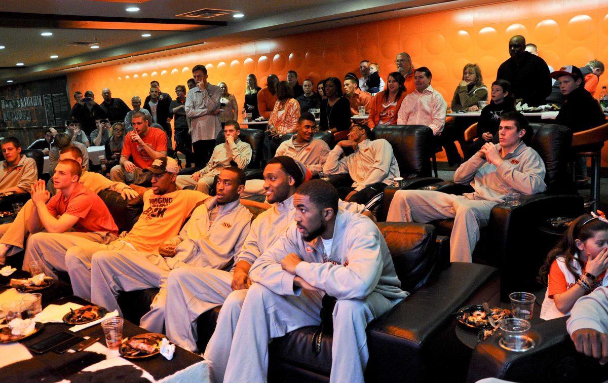 The Oklahoma State team waits to learn their NCAA college basketball tournament assignment during a Selection Sunday viewing party, Sunday, March 17, 2013, in Stillwater, Okla. Oklahoma State is scheduled to face Oregon in the second round on Thursday. (AP Photo/Tulsa World, KT King)