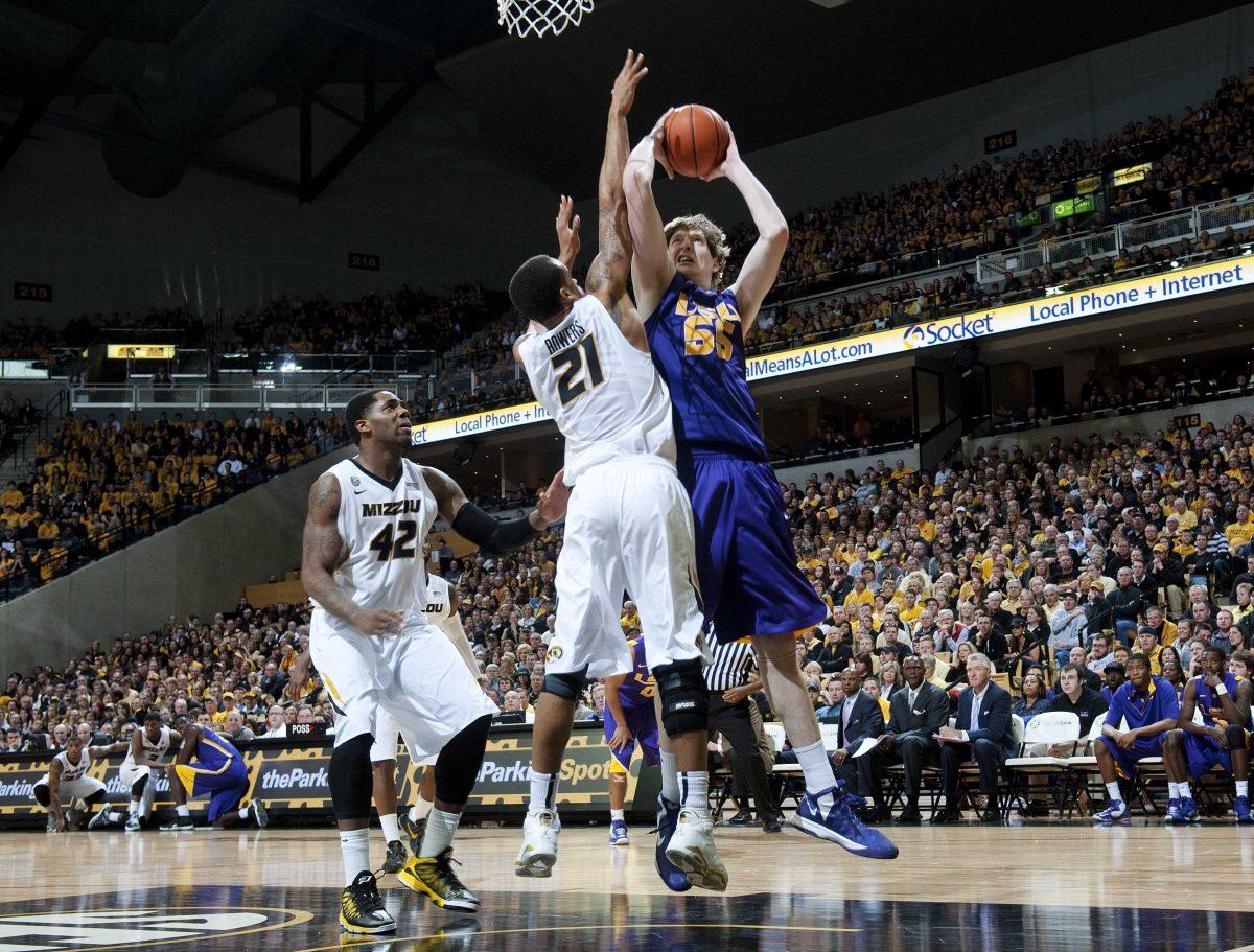 LSU's Andrew Del Piero, right, is tries to shoot over Missouri's Laurence Bowers, center, as Alex Oriakhi, left, moves in during the second half of an NCAA college basketball game Saturday, March 2, 2013, in Columbia, Mo. Missouri won the game 89-76. (AP Photo/L.G. Patterson)