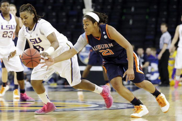 LSU guard Bianca Lutley (3) has the ball stolen by Auburn guard Chadarryl Clay (21) during the second half of their NCAA college basketball game in the Southeastern Conference tournament, Thursday, March 7, 2013, in Duluth, Ga. LSU won 65-62. (AP Photo/John Bazemore)
 