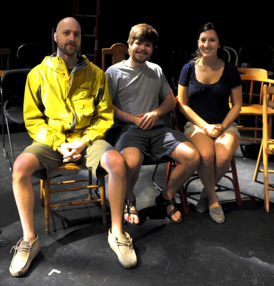 <p>Sound Designer and Theatre senior Devon Lamond (left), Director and Theatre senior Peryn Schmitt (center), and Lighting Designer and Theatre senior Adam Waguepack (right) sit in the audience's seats Monday, April 15, 2013.</p>