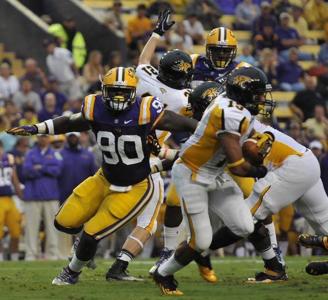 Sophomore defensive tackle Anthony Johnson (90) chases the carrier Saturday, September 29, 2012 during the Tigers' 38-22 win over Towson in Death Valley.