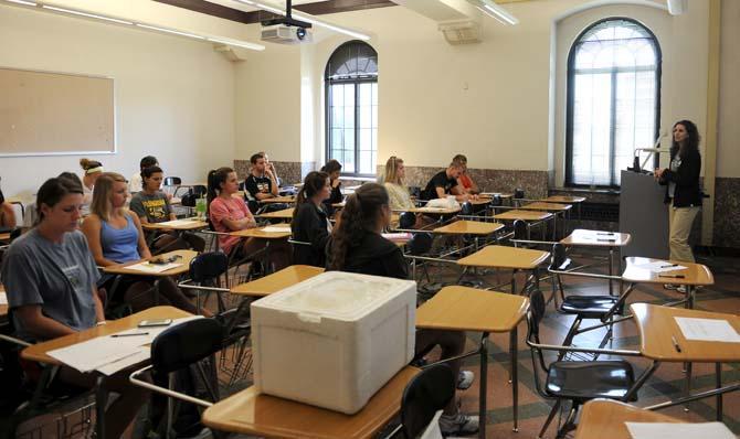 Dr. Stewart speaks to her KIN 4525, section 1 class Tuesday, April 23, 2013. The class will be running the Kentucky Derby marathon in support of those injured in the Boston Marathon bombings.
 