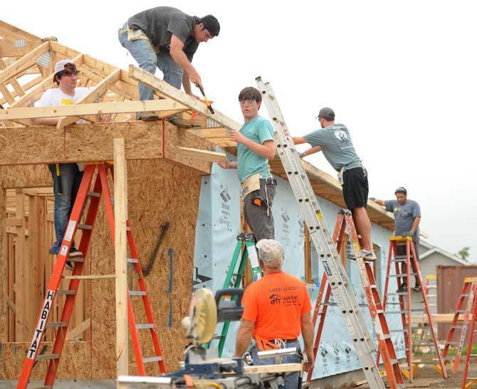 LSU students help Habitat for Humanity build a home for the Miles family April 15, 2013, on Elvin Drive.
 