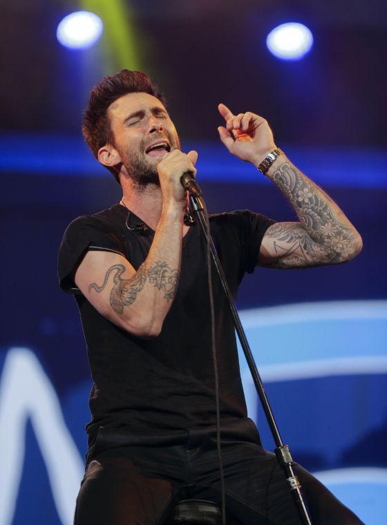 FILE - This Jan. 7, 2013 file photo shows Maroon 5 lead singer Adam Levine during the Consumer Electronics Show in Las Vegas. Taylor Swift, Maroon 5 and fun. are finalists in 11 categories at the Billboard Music Awards, announced Monday, April 22. Swift, Maroon 5, Rihanna, One Direction and Justin Bieber will compete for the top artist award. The Billboard Music Awards will air live May 19 from the MGM Grand Garden Arena in Las Vegas on ABC. (AP Photo/Julie Jacobson, file)
 