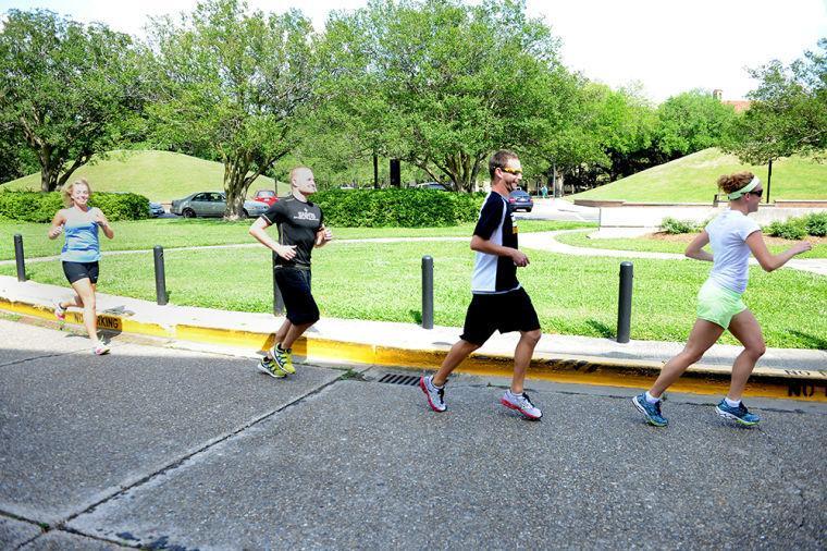 Assistant professor Laura Stewart&#8217;s kinesiology class jogs Tuesday in front of the Huey P. Long Fieldhouse. They are running the Kentucky Derby Marathon in support of Boston.
 