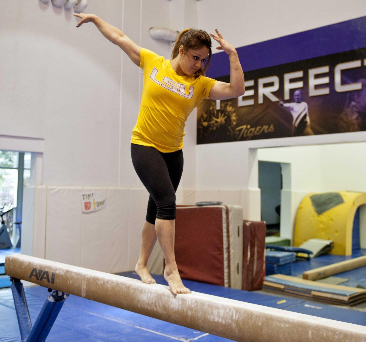 Kinesiology freshman Jessica Savona practices the "moonwalk" portion of her gymnastics routine Monday, April 15, 2013.