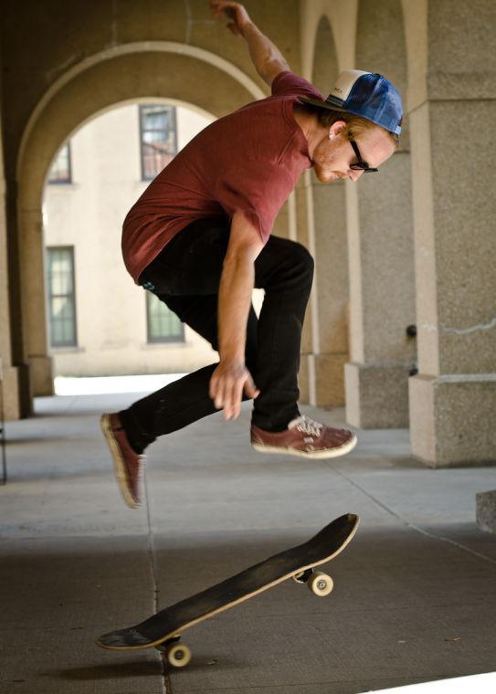 Digital art junior Hunter Esmon pops a trick in the Quad.