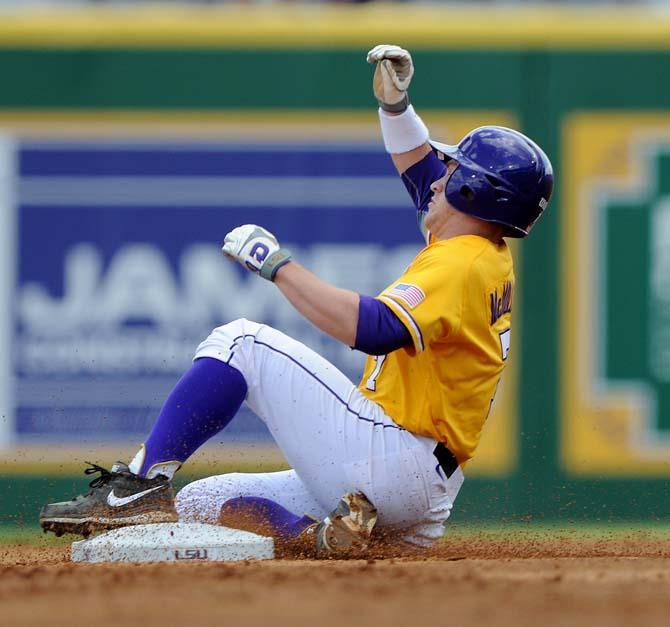 LSU junior outfielder Sean McMullen (7) slides into second base Sunday, April 7, 2013 during the Tigers' 11-4 victory against Kentucky in Alex Box Stadium.
 