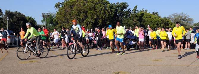 A crowd takes off Saturday, April 20, 2013, at the steps of the Louisiana State Capitol for Baton Rouge Run for Boston, a 2.62 mile run organized by several local running clubs to support victims of the Boston Marathon bombing.
 