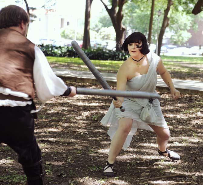 Sociology freshman and necromancer Kira Hellmers (right) and computer engineering freshman and fighter Jonathon Cowart (left) duel as a part of live action role-playing April 22, 2013, in the Enchanted Forest.
 