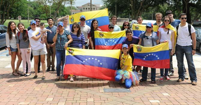 Venezuela-native and Venezuela-sympathetic protesters gather in protest near the Memorial Tower Tuesday, April 16, 2013. They are protesting the most recent presidential election in Venezuela, calling for a vote recount.
 