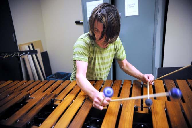 Philosophy junior Connor Parsons rehearses an experimental percussion piece Saturday, April 13, 2013 in a practice room located in the Music and Dramatic Arts Building.
 