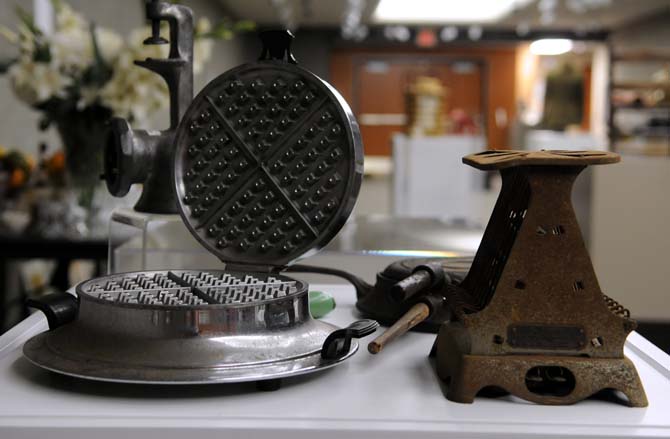 Some antique common household appliances stand on display in the LSU Union Art Gallery as a part of the showing titled A Slice of South Louisiana.
 