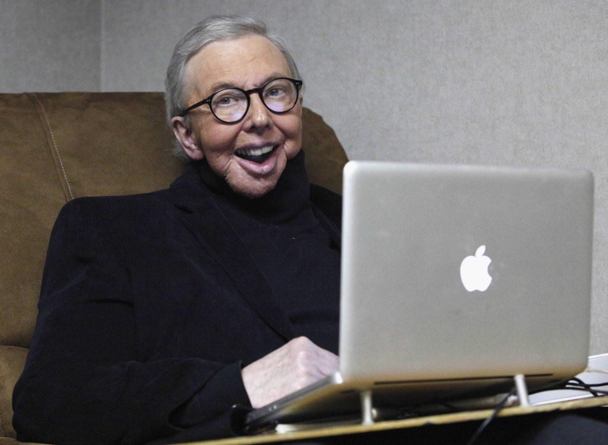 FILE - In this Jan. 12, 2011 file photo, Pulitzer Prize-winning movie critic Roger Ebert works in his office at the WTTW-TV studios in Chicago. Ebert died on Thursday, April 4, 2013. He was 70. Ebert started out as an old-school newspaper man, the kind that has all but vanished: a fierce competitor who spent the day trying to scoop the competition and the night bellied up to the bar swapping stories. Then newspapers fell on hard times, either laying off huge chunks of their staffs or disappearing altogether. But Ebert didn't merely survive. He flourished, largely by embracing television and later the Internet and social networks. (AP Photo/Charles Rex Arbogast, File)