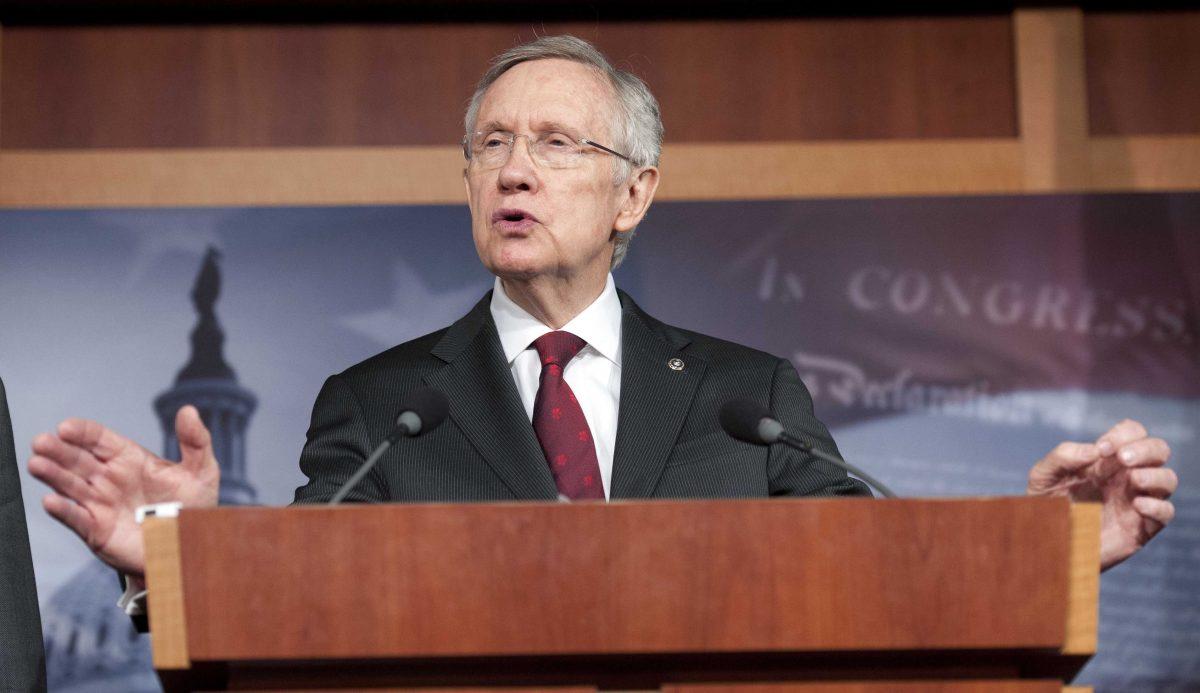 FILE - In this March 14, 2013, file photo, Senate Majority Leader Harry Reid, D-Nev., speaks on Capitol Hill in Washington. Congress returns Monday, April 8, 2013, from a two-week spring recess with gun control and immigration high on the Senate's agenda. Short of unanimous support in their own party, Democratic senators have been unable to strike a deal with Republicans for the votes they will need to push background check legislation through the chamber. Reid might delay debate to give bargainers more time, underscoring how crucial the proposal is to the gun control drive. (AP Photo/Cliff Owen, File)