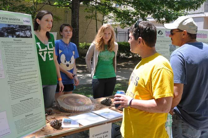 Biology seniors Courtney tuminello, Jordan Edwards and Laura Mullen talk to people Sunday, April 21, 2013, about their work with conservation during Louisiana Earth Day held in downtown Baton Rouge.
 