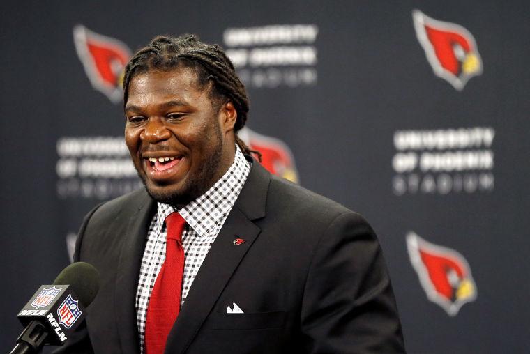 Arizona Cardinals first-round draft pick Jonathan Cooper is introduced on Friday, April 26, 2013, at the Cardinals' training facility in Tempe, Ariz. Cooper was selected seventh overall in the NFL football draft. (AP Photo/Matt York)
 