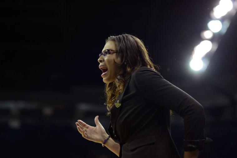 LSU's head coach Nikki Caldwell exchanges words with an official in the first half of a regional semifinal game against California in the NCAA women's college basketball tournament, Saturday March 30, 2013 in Spokane, Wash. (AP Photo/Jed Conklin)
 