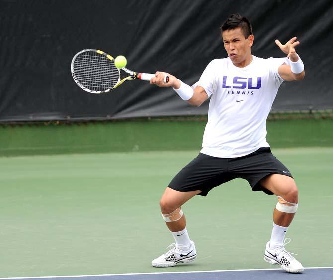 LSU senior Stefan Szacinski goes to return a serve Friday, March 22, 2013 during the Tigers' doubles match against the Ole Miss Rebels in W.T "Dub" Robinson Stadium.