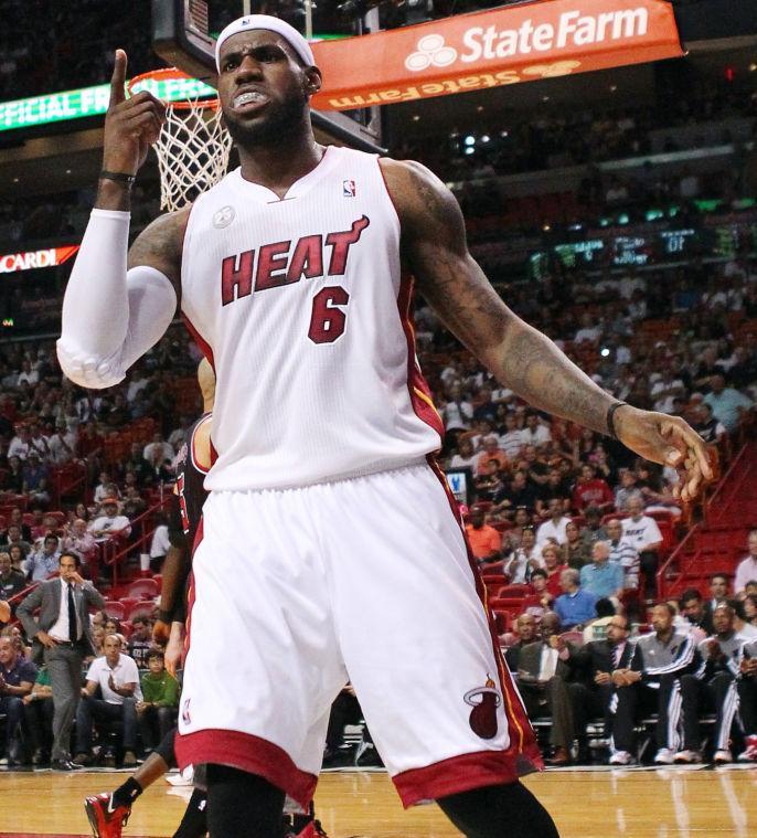 Miami Heat's LeBron James (6) reacts after a play during the first quarter of an NBA basketball game against the Chicago Bulls in Miami, Sunday, April 14, 2013. The Heat won 105-93. (AP Photo/El Nuevo Herald, David Santiago)
 