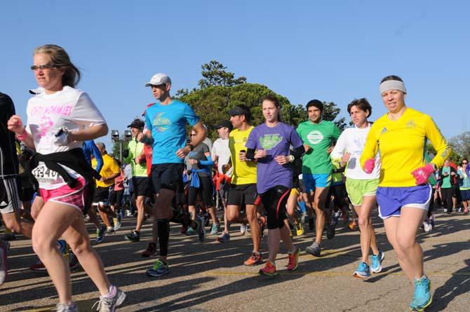 A crowd takes off Saturday, April 20, 2013, at the steps of the Louisiana State Capitol for Baton Rouge Run for Boston, a 2.62 mile run organized by several local running clubs to support victims of the Boston Marathon bombing.
 