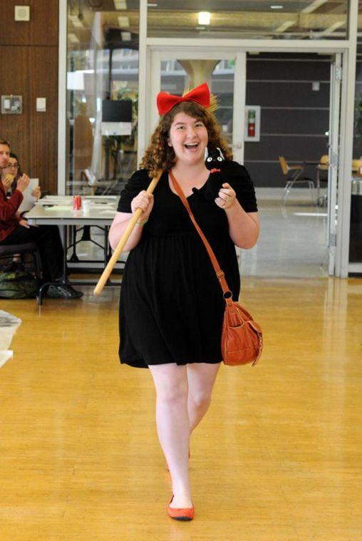 English and History freshman Jennifer Strength walks during the "most creative" portion of Rescon 2013's cosplay catwalk. She was dressed as Kiki from the animated movie "Kiki's Delivery Service."
 