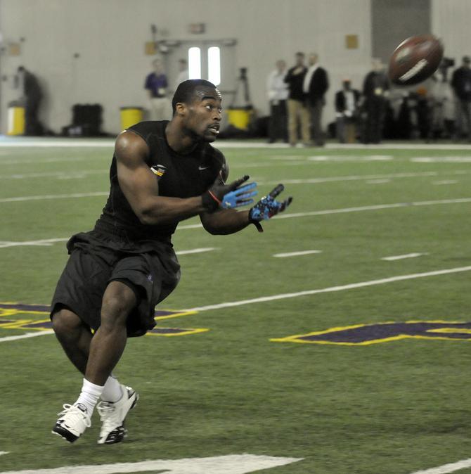 LSU junior running back Michael Ford (42) catches the football Wednesday, March 27, 2013 during Pro Day at Football Operations Center.