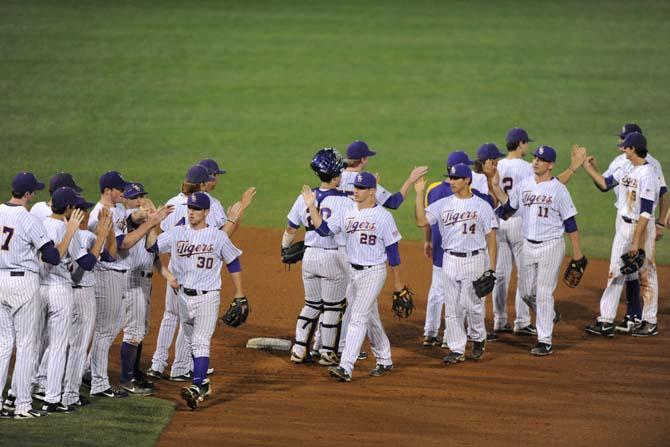 The Tigers celebrate their 7-3 win Tuesday, April 30, 2013, during their game against the MSU Cowboys.
 