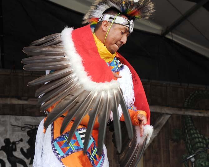 A dancer performs the Eagle Dance as part of the Stoney Creek Singers with Yellow Bird Indian Dancers performance Saturday, April 27, 2013 at the New Orleans Jazz &amp; Heritage Festival on the Fair Grounds Race Course.
 