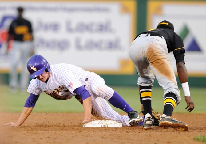 LSU freshman outfielder Andrew Stevenson (6) slides into second plate April 17, 2013, during the Tigers' 4-0 victory against Grambling at Alex Box Stadium.
 