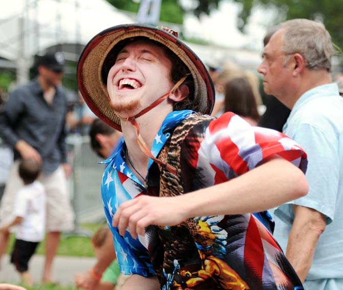 Sam Perkins dances to Sunny Duval April 27, 2013, at Festival International de Louisiane in Lafayette, La.
 