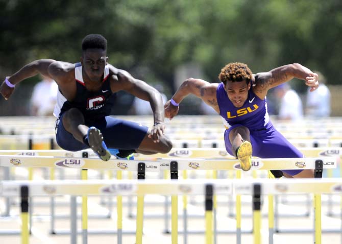 UCONN sophomore Selwyn Maxwell (left) and LSU sophomore Joshua Thompson (right) run the 110 meter hurdles Saturday, April 13, 2013.
 