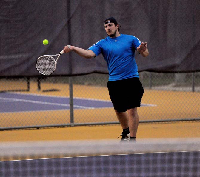 Construction Management Cory Manuel hits a tennis ball during practice Monday, April 8, 2013. The national tennis competition will be held Thursday in Surprize, AZ.
 