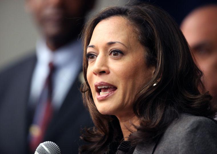 FILE - This Nov. 16,2012 file photo shows California Attorney General Kamala Harris speaking during a news conference in Los Angeles. President Barack Obama praised Harris for more than her smarts and toughness at a Democratic Party event Thursday, April 4, 2013. The president also commended Harris for being "the best-looking attorney general" during a Democratic fundraising lunch in the Silicon Valley.(AP Photo/Richard Vogel,File)
 