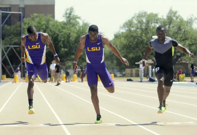 LSU senior Damar Forbes (left), LSU junior Shermund Allsop, and Gabriel Mvumvure sprint during the Men's 100 meter dash Saturday, April 13, 2013.
 