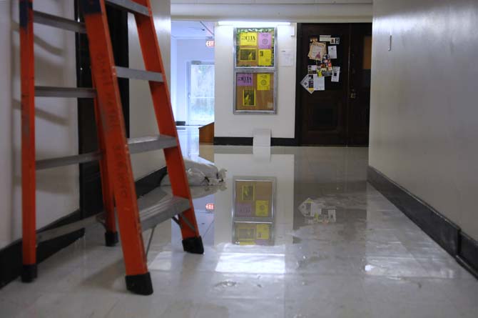 A large puddle spreads through the basement of Allen Hall on Wednesday, April 24, 2013.
 